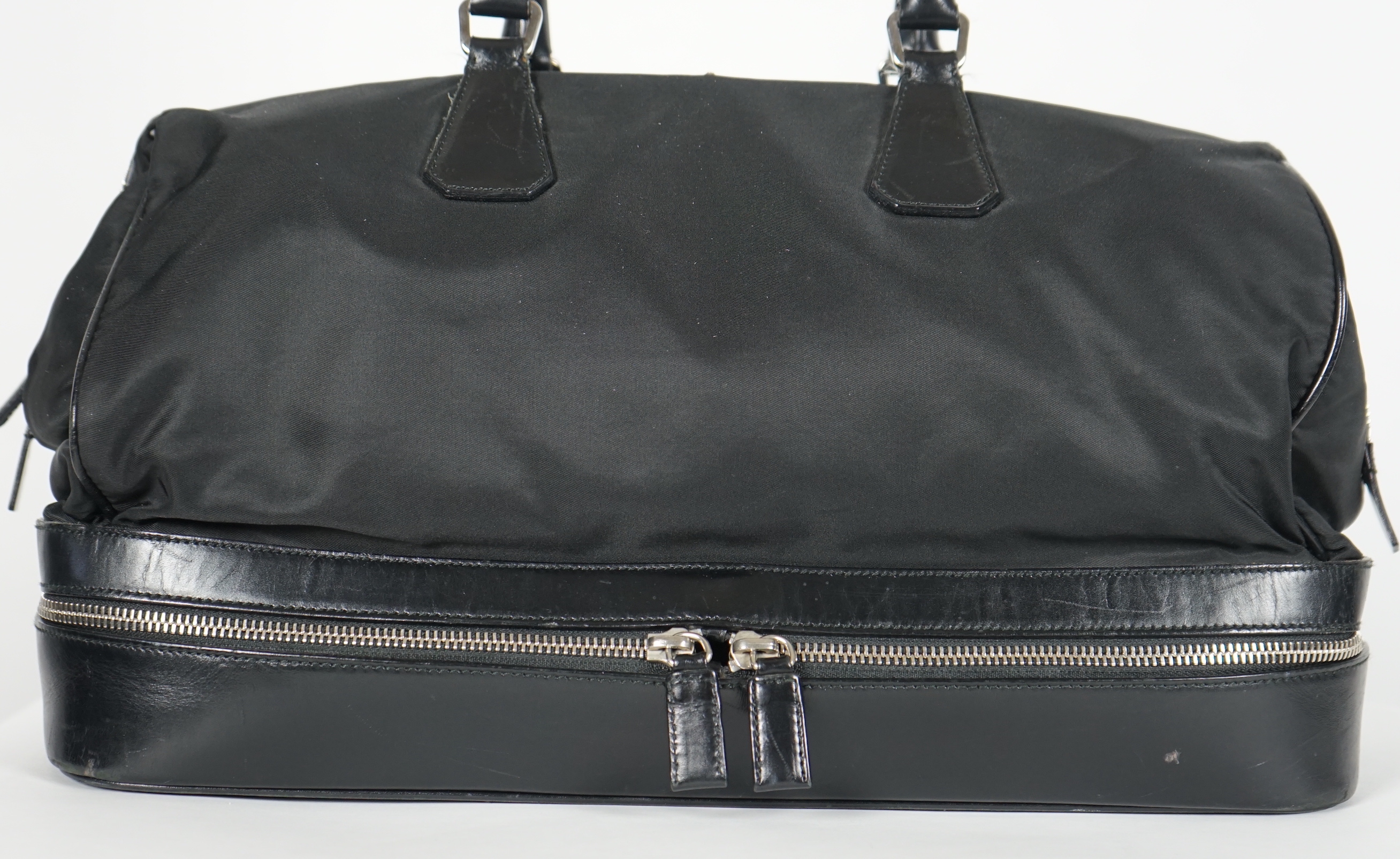 A Prada Tessuto black nylon and leather bag, width 38cm, height 23cm, depth 50cm